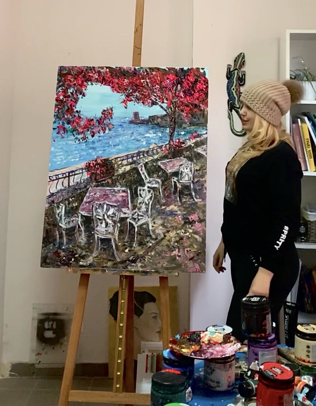 Marina Stognieva with the completed painting Positano Terrace in her art studio, Kyiv, 2021
